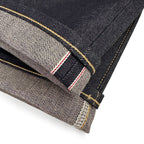 Closeup of the HFD-01 redline selvedge ID and vintage-style chain stitched hem of Japanese selvedge denim relaxed fit wide leg jeans.