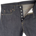 Closeup of HFD03 Japanese selvedge denim regular fit slim leg jeans showing the button fly, waistband, rivets, and front pockets.