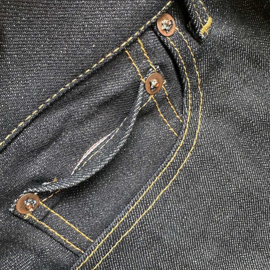 Closeup of the HFD04 coin watch pocket on Japanese selvedge denim slim fit straight leg jeans showing redline selvedge edge detail.