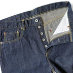 Closeup of HFD-02 Japanese selvedge denim once washed  relaxed fit tight tapered leg jeans showing the button fly, waistband, rivets, and front pockets.