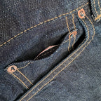 Closeup of the HFD-04W coin watch pocket on Japanese selvedge denim once washed slim fit straight leg jeans showing redline selvedge edge detail.